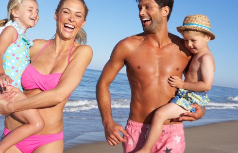 Family Having Fun On Beach