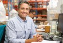 Businessman Working At Desk In Warehouse