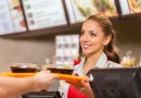 Restaurant worker serving two fast food meals